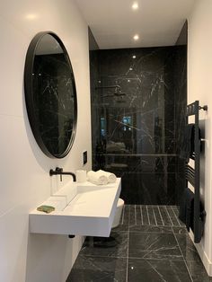 a black and white bathroom with two sinks