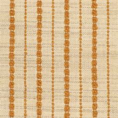 an orange and white striped fabric with small dots on the bottom, in rows of vertical stripes