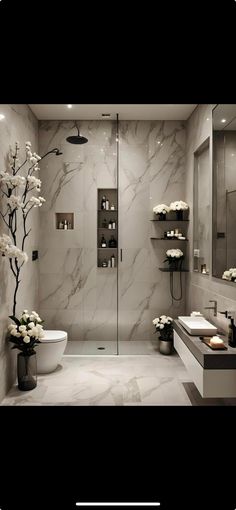 a modern bathroom with marble walls and flooring