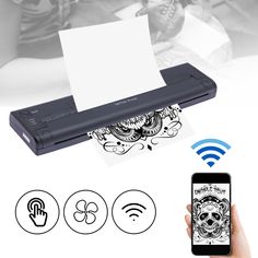 a hand holding a cell phone with an image of a skull on it next to a printer