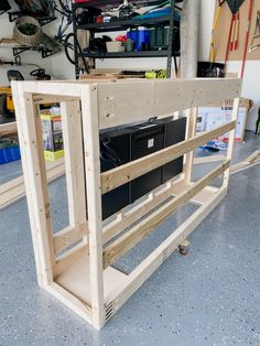 an unfinished computer desk in a garage