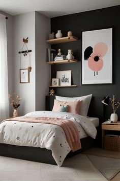 a bedroom with black walls and white bedding, pink accents on the comforter