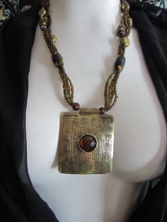 This unique necklace with look great with your casual outfit,  jeans and a  tee shirt or with that simple black flowy dress. Nice condition. the beads are glass 80s Jewelry, Vintage Beads Necklace, Boho Vintage, Boho Accessories, Funky Jewelry, Brass Pendant, Fantasy Jewelry, Vintage Boho, Unique Necklaces