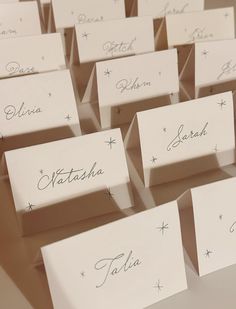 there are many place cards with names on them for guests to write in the box