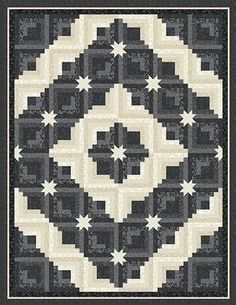 a black and white quilt with stars in the center on it's border,