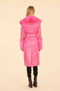 Embrace your playful side with our Faux Leather Trench Coat with Faux Fur Trim. This coat features exaggerated lapels and large cuffs for a touch of drama, while the belted waistline creates a flattering silhouette. Available in striking Hot Pink, this faux leather trench coat offers a fun contrast to traditional fall and winter colors. The unexpected and eye-catching color choice, combined with the playful design elements, makes this coat perfect for those who want to show off their unique styl Fitted Evening Outerwear With Belted Cuffs, Luxury Fitted Outerwear With Belted Cuffs, Luxury Spring Outerwear With Belt Loops, Fitted Belted Outerwear For Evening, Fitted Belted Evening Outerwear, Chic Leather Fur Coat For Work, Spring Outerwear With Self Belt, Spring Evening Outerwear With Belted Cuffs, Elegant Party Outerwear With Belted Cuffs