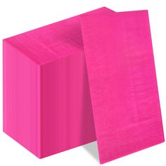 bright pink tissue paper is folded on top of each other to form a rectangle shape