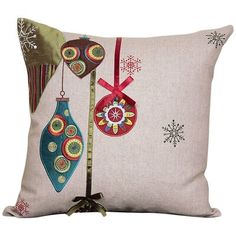 a decorative pillow with ornaments hanging from it