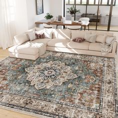 a living room with a large rug on the floor