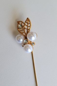 "Enhance clothing, hats, purses or handbags with unique brooches, pins or stick pins. This gold tone stick pin features a carved white Mother-of-Pearl flower with a crystal rhinestone in the center.  It has a gold tone filigree leaf. The flower is 32mm. The pin is almost 3\" long. Custom orders are always welcome!" Gold Flower Lapel Pin For Formal Occasions, Elegant Gold Flower Lapel Pin, Gold Flower Pins For Wedding, Unique Brooches, Unique Brooch, Unusual Earrings, Providence Ri, Sterling Bracelets, Bracelet Earring Set