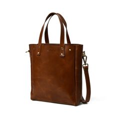 Introducing Executive Elegance- The Sleek Brown Leather Women's Office Shoulder Bag. With a spacious central compartment, it easily accommodates your laptop, files, and more. Inside, a small zippered pocket adds organizational convenience. The adjustable strap allows comfortable shoulder wear, while sturdy handles offer a handbag option. Crafted from premium buffalo hide and artisanally handcrafted, this bag is a blend of sophistication and functionality for the modern professional woman. Salien Classic Everyday Crossbody Laptop Bag, Classic Crossbody Laptop Bag, Leather Laptop Bag With Zipper Pocket For Office, Elegant Leather Laptop Bag With Zipper Pocket, Leather Laptop Bag With Zipper Pocket For Work, Everyday Use Briefcase With Zipper Closure, Classic Laptop Bag With Double Handle And Zipper Closure, Classic Crossbody Bag With Laptop Sleeve, Classic Laptop Bag For Everyday Use