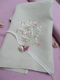 a close up of a piece of cloth with flowers on it