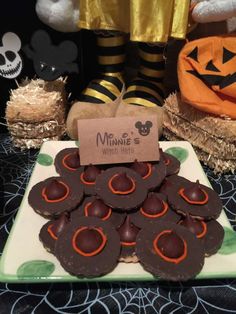 some chocolates are on a plate with candy in the shape of jack - o'- lanterns