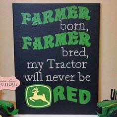 there is a sign that says farmer born, farmer bred my tractor will never be red