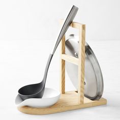 a spoon and spatula on a wooden stand