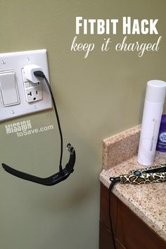 a hair dryer plugged in to a wall with the words fit hack keep it charged