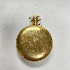 "f895 Antique Illinois Gold Tone Mechanical Pocket Watch Pre-owned item. Please see pictures for details. Sold as is, as seen on pictures, no returns on vintage/antique items. We do not alter/polish antique items and try to keep items as original as possible. Watch were checked and serviced, good working condition. Antique Illinois Watch Co. Springfield Mechanical Pocket Watch. Gold tone. Movement #2034301. Dial shows some damage at 5 o'clock, please see pictures. Approx. measurements. 47mm in d Antique Finish Gold Pocket Watch, Antique Gold Round Pocket Watch, Vintage Engraved Pocket Watch For Formal Occasions, Vintage Medallion Pocket Watch For Weddings, Vintage Medallion Pocket Watch For Wedding, Gold Round Pocket Watch With Antique Finish, Vintage Engraved Yellow Gold Watch Accessories, Antique Gold Engraved Watch Accessories, Vintage Engraved Gold Watches