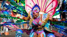 a woman dressed in colorful costume and headdress