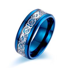 a blue wedding ring with an intricate design on the outside and inside, set in 18k white gold