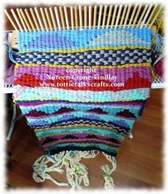 a crocheted blanket sitting on top of a wooden chair