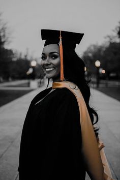 a woman wearing a graduation cap and gown