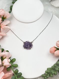 Adorable and classic amethyst cluster necklace that will never go out of style! Featuring a sterling silver box chain with a single small amethyst cluster pendant that hangs from a ring on each side. The chain is super adjustable and can be worn at 5 different lengths. While you cannot choose the exact necklace you will receive, you can select Chain adjusts from 14" to 18" with an adjustment at each inch. You will received ONE necklace that is intuitively picked for you of your selected color ra Purple Sterling Silver Flower Pendant Jewelry, White Gold Amethyst Jewelry, Amethyst Flower Pendant Jewelry For Gift, Amethyst Flower Pendant Jewelry Gift, Purple Sterling Silver Jewelry As Gift For Her, Purple Sterling Silver Jewelry Gift For Her, White Gold Amethyst Birthstone Necklace, Sterling Silver Purple Flower Pendant Necklace, Sterling Silver Flower Pendant Necklace In Purple