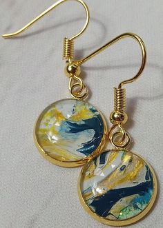 Set #2 of 3| Same colors with different designs| Handmade custom designed Dangle Earrings with hook| Multicolored| Small Round Shaped|  Blue, Gold, White and Green| Gold Earring set. Artistic Blue Round Earrings, Painted Earrings, Trendy Gift, Round Earrings, Unique Earrings, Green And Gold, Earring Set, Gold Earrings, Jewelry Earrings Dangle