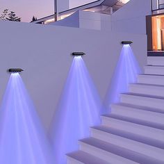 there are three lights that are on the stairs