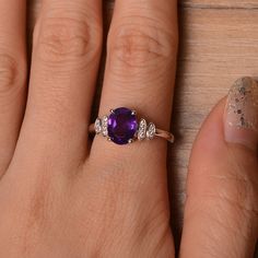 It is natural amethyst ring, the main stone is about 7mm*9mm, oval cut, weight about 1.77 carats. The basic metal is sterling silver and plated with rhodium. To change the metal to a solid gold (white/rose) or platinum is also available, please ask for a quotation if you want. You can also go to my shop Home for more elegant rings: https://www.etsy.com/shop/godjewelry?ref=hdr_shop_menu Amethyst is February birthstone. More amethyst rings: https://www.etsy.com/shop/godjewelry?ref=seller-platform- Elegant Sterling Silver Amethyst Ring Oval Cabochon, Oval Amethyst Ring With Accent Stones For Anniversary, Oval Amethyst Ring In White Gold For Anniversary, Oval Amethyst Ring In White Gold With Accent Stones, Oval White Gold Amethyst Ring For Anniversary, Oval Amethyst Promise Ring In White Gold, Lavender Amethyst Ring In Oval Sterling Silver, White Gold Amethyst Promise Ring With Oval Shape, Lavender Oval Amethyst Ring In Sterling Silver