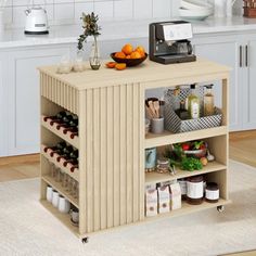 a kitchen cart with food on it in the middle of a flooring area next to a counter