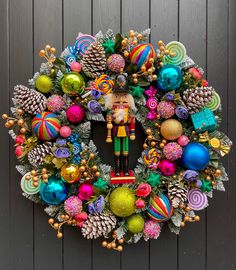 a wreath with ornaments and a nutcracker on it