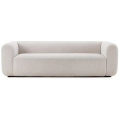 a light gray couch sitting on top of a white floor