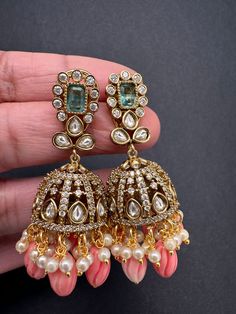 Moissanite AD Tulip Beads Jhumkas pushback earringsColor : VictorianSize : Length : 2 Inches; Weight : 10 grams eachStones : AD Stones Pearls Tulip Beads Ad Earrings Design, Traditional Jhumkas, Tulip Beads, Desi Jewelry, Classic Jewelry Pieces, Jhumka Designs, Ear Chain, Jhumki Earrings, Traditional Earrings