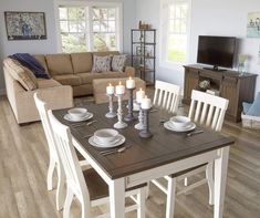 a living room and dining area with wood flooring