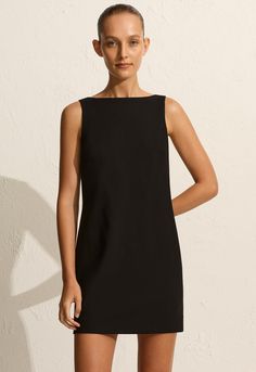 Reminiscent of the the 90s, our Crepe Mini Shift Dress is crafted in our easy-wear, lightweight wool-blend crepe. Featuring a relaxed shift silhouette, boat neckline and invisible centreback zip. Effortlessly elegant, it’s the only dress you need to pack for your next summer city escape. 90s Minimalism, Minimalist Clothing, Tailored Clothes, Straight Dress, Shift Dress Black, The Invisible, Dress Silhouette, Boat Neckline, Mini Shift Dress