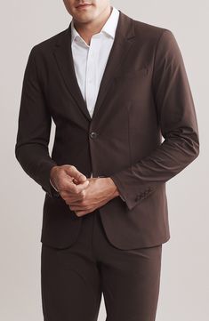 Commute comfortably in this slim-fitting blazer made from a wrinkle-resistant fabric with front flap pockets and neatly notched lapels. 29" length (size Medium)   Notched lapels   Partially lined   56% recycled polyester, 44% polyester   Dry clean   Imported Modern Solid Long Sleeve Suits, Fitted Recycled Polyester Outerwear For Fall, Modern Solid Color Long Sleeve Suit, Stretch Business Blazer With Long Sleeves, Modern Stretch Outerwear For Work, Stretch Blazer For Business, Stretch Long Sleeve Blazer For Business, Classic Stretch Outerwear For Business Casual, Classic Stretch Outerwear For Formal Occasions