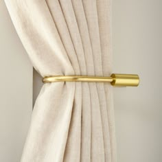 a curtain with a gold rod attached to it