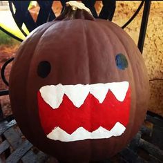 a pumpkin decorated to look like a monster's teeth