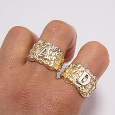 Nugget Design Initial Letter Ring Solid 10K Yellow White Gold All Sizes * Metal : Real 10K Gold (Properly Stamped, 10K) * Condition : Brand New * Finish : Polished * Average Weight : Size 10: 4.28 grams * Length : 15.5mm = 5/8" * Width : 15.5mm = 5/8" * Clasp/Bail : Can be resized down or up at your local jeweler. **The weight will change depending on the letter and the size you choose. All of our items are brand new and are shipped with a gift box. Gold Ring With Hallmarks, Gold Engraved Ring For Birthday, Gold Engraved Rings For Birthdays, Gold Rings For Birthday - Fine Jewelry, Fine Jewelry Gold Rings For Birthday, Gold Fine Jewelry Rings For Birthday, Gold Initial Ring With Diamond Cut In 14k, Gold Diamond Cut Initial Ring In 14k Gold, Gold Nugget Ring