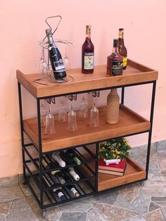 a shelf with wine glasses and bottles on it