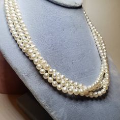 "Lovely vintage freshwater baroque cultured pearl necklace. 3 strands with a sterling chain and hook clasp. A really neat detail on this necklace are the clasp ends, which are sterling hearts. Marked \"935\" Unidentified makers mark. It looks like a lower case e inside of a diamond. Condition is excellent. Ready to wear. There are no dents or dings. No loose or missing pearls. No repairs." Vintage Pearl Necklace For Formal Occasions, Antique Round Pearl Necklace For Wedding, Antique Pearl Chain Necklace For Formal Occasions, Vintage Pearl Necklaces For Formal Occasions, Victorian Pearl Necklaces For Formal Occasions, Vintage Pearl Drop Necklace For Anniversary, Vintage Pearl Drop Necklaces For Formal Occasions, Vintage Round Pearl Necklace For Formal Occasions, Vintage Pearl Pendant Necklace