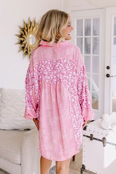 - Add this adorable casual brunch option to your wardrobe this season! - Unlined soft material patterned with panels of a paisley and a floral print - Unfinished seam accents - A collared neckline - A button up front - Long loose sleeves with button closure cuffs - A relaxed silhouette that ends in an uneven hemline with a curved back Pink Blouse With Button Closure For Vacation, Pink Button-up Blouse For Vacation, Pink Buttoned Beach Blouse, Pink Collared Blouse For Beach, Pink Blouse With Buttons For The Beach, Spring Pink Patchwork Blouse, Pink Patchwork Blouse For Spring, Pink Long Sleeve Tops With Floral Patchwork, Pink Floral Print Collared Blouse