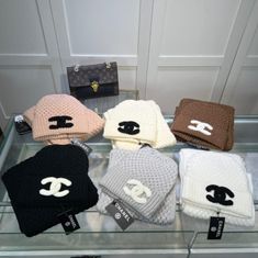 Level up your cold weather wardrobe with our beanie and scarf set. Featuring a soft thick knit cashmere material and a CC knitted logo. This set is sure to give you a statement look during the colder months and to keep you warm and cozy. Designer Shawl, Accessories 2023, Cc Hats, Classy Hats, Chanel Set, Chanel Scarf, Chanel Hat, Logo Hat, Knit Logo