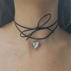 "The Keke Suede String Heart Necklace 🤍 Featuring a stainless steel puffy heart pendant, and a 48\" cut suede string cord. There are a ton of ways to wear this necklace (you can even wear it as a waist belt!) and if you need a custom length, DM me! Choose between gold and silver at checkout Unisex & tarnish proof 🖤 Made with love" Silver Heart Necklace Black Cord, Silver Heart Choker, Cute Black Heart-shaped Necklaces, Cute Black Heart Necklace, Cute Black Heart-shaped Necklace, Cute Black Necklace For Valentine's Day, Cord Necklace Diy, Chunky Heart Necklace, Suede Cord Necklace