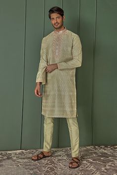 Olive green chanderi silk kurta with all over Mughal jaal pattern, tonal resham embroidery and contrast floral dori work yoke. Paired with contrast pyjama. - Aza Fashions Green Chanderi Sherwani For Eid, Eid Sherwani In Pista Green Chanderi, Green Cotton Silk Sherwani With Zari Work, Traditional Pista Green Chanderi Sherwani, Green Chanderi Sherwani For Diwali, Pista Green Chanderi Sherwani For Festive Occasions, Festive Pista Green Chanderi Sherwani, Green Chanderi Sherwani For Navratri, Green Chanderi Sherwani With Cutdana Details