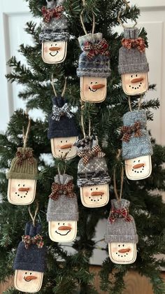 a christmas tree with snowmen hanging from it