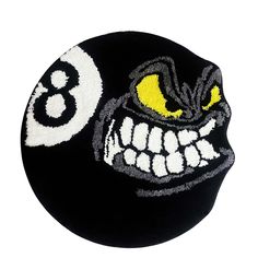 a close up of a black ball with yellow and white numbers on it's face