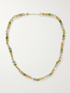 JIA JIA's necklace is hand-strung with an array of colorful stones - including peridot, lemon quartz and green amethyst - that are meant to evoke joy. If you look closely, you'll see each one is left in its natural form, making them truly unique. Adjust the slim gold chain between 18- and 19-inches, depending on your neckline. Fine Jewelry Green Necklace With Stones, Green Tourmaline Gemstone Necklace, Green Fine Jewelry Necklaces With Natural Stones, Green Natural Stones Fine Jewelry Necklace, Green Natural Stone Fine Jewelry Necklace, Green Citrine Jewelry With Natural Stones, Green Tourmaline Necklace In Fine Jewelry Style, Green Multi-stone Beaded Necklace For Gift, Green Briolette Necklace With Natural Stones