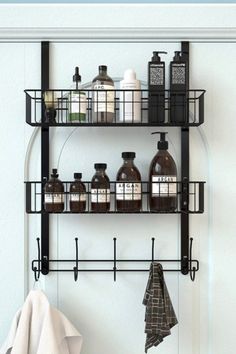 a shelf with bottles and towels on it