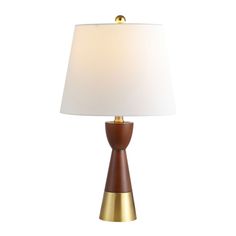 a wooden table lamp with a white shade on the top and gold trim around the base